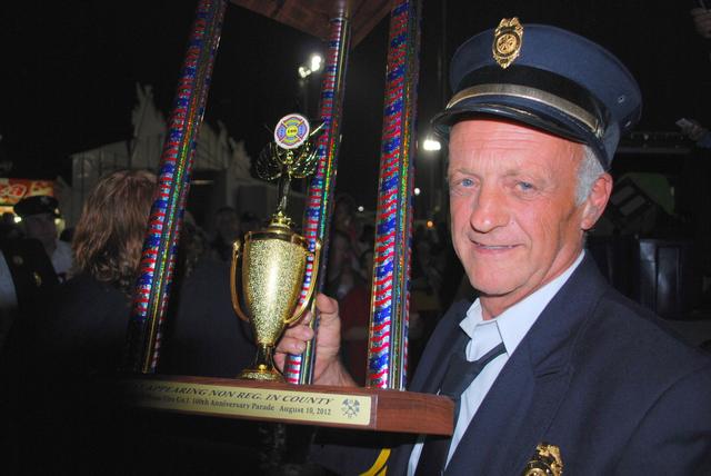 DCVFA County Convention Parade Hopewell Junction, NY - 

Pawling FD Department President Dennis Brunow with our Trophy for Best Non-Regulation Uniform - 

August 10, 2012